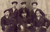 Crew members of the submarine Delfinul. Ion Agiu is in the center of the group, behind the captain.